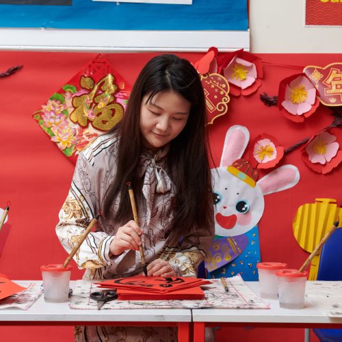 girl doing Chinese calligraphy