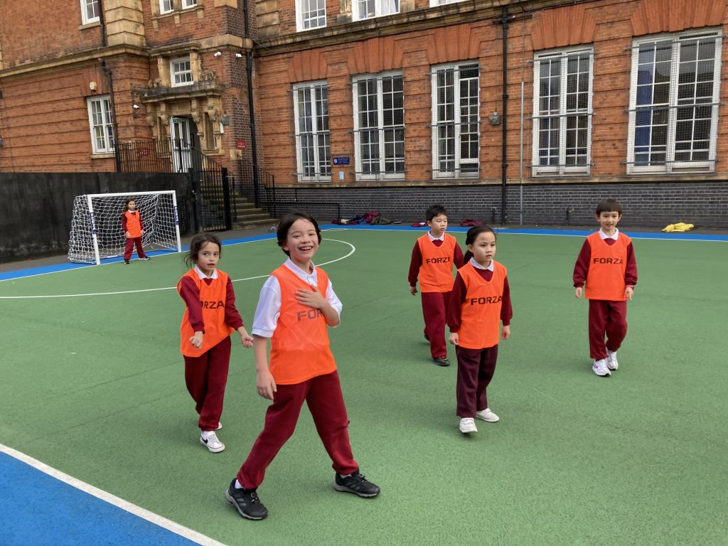 students on a football pitch