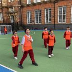 students on a football pitch