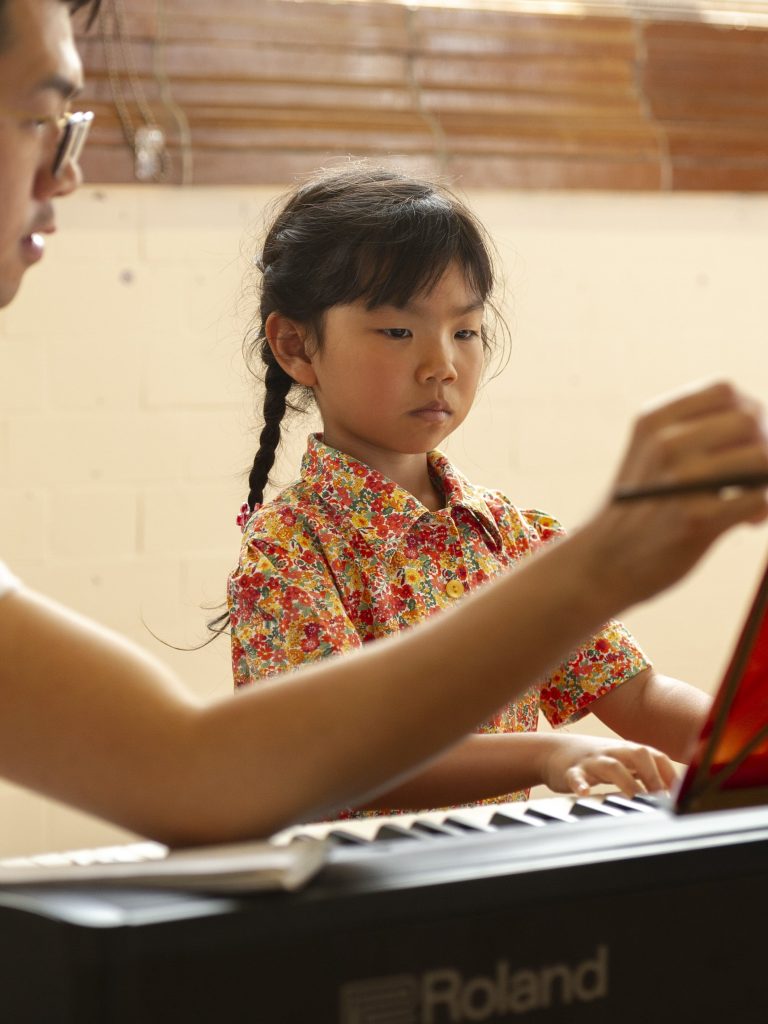 student playing the keyboard