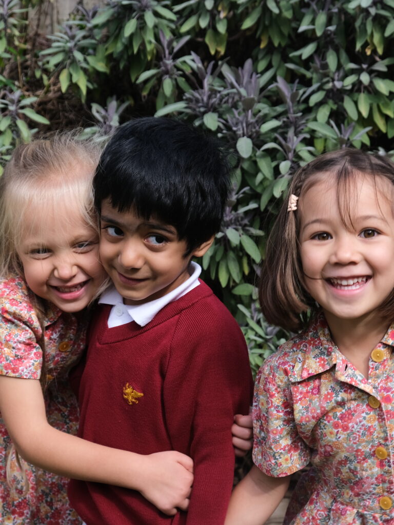 young students hugging each other